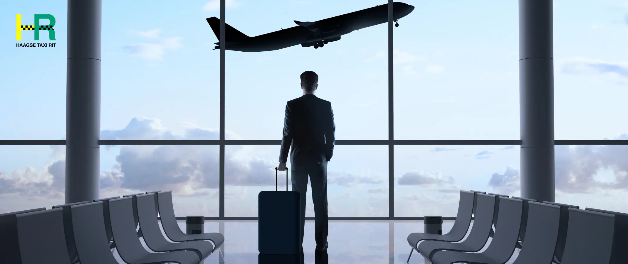 Business traveler at an airport window with airplane taking off, booking taxi denhaag and airport taxi denhaag for a reliable airport transfer.